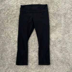 Lululemon black leggings. Come to your calf. Good condition. Black. Size 4.